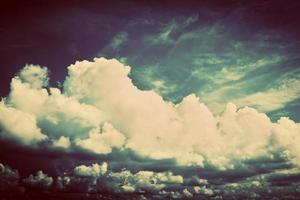 Sky with fluffy clouds. Retro, vintage style photo