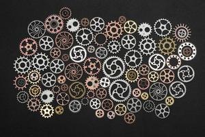 Bunch of cogwheels on black background. photo