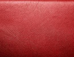 Soft wrinkled red leather. Texture or background photo