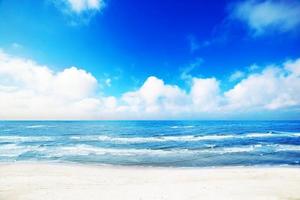 Hot summer beach, sea scenery, blue sunny sky photo