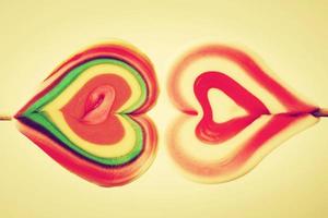 Colorful heart shaped sweet lollipops photo