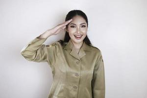 government worker wearing a brown uniform doing salute pose photo