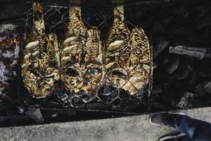 Grilled fish with charcoal for sale at street food market or restaurant in Indonesia photo