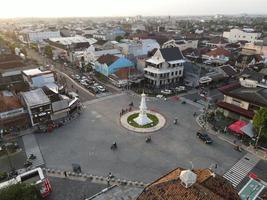 Aerial view of Tugu Yogyakarta Landmark with busy traffic. Yogyakarta, Indonesia - March, 2022 photo
