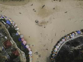 Umbrella in sandy beach at Yogyakarta in Indonesia photo