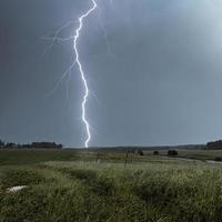 Lightning strike during a thunder storm photo