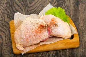 Raw chicken thigh photo