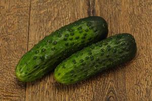 Ripe fresh green two cucumbers photo