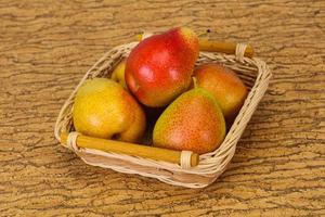 Pear heap in the wooden basket
