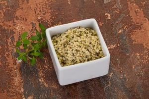 Peeled hemp seeds in the bowl photo