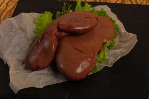 Raw pork kidneys photo