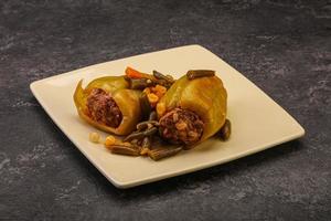 Baked stuffed bell pepper with meat photo