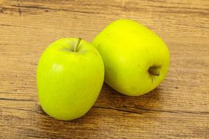 Two ripe green sweet apples photo