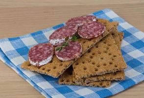 Crispbread with salami photo