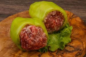 Raw stuffed bell pepper with meat photo