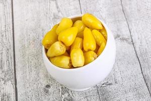 Pickled Yellow spicy mini pepper photo