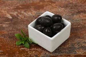 Black olives in the bowl photo