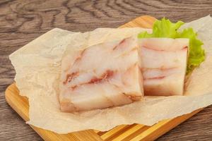 Raw pollock fish fillet for cooking photo