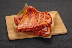 Raw marinated pork ribs photo