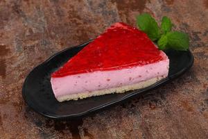 Soft Raspberry cheesecake served mint photo