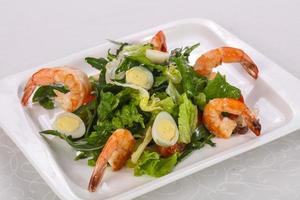 Salad with prawn, rocket and eggs photo