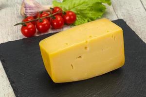 Hard yellow tasty cheese brick photo