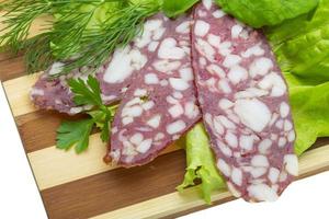 Sausages with salad and basil photo