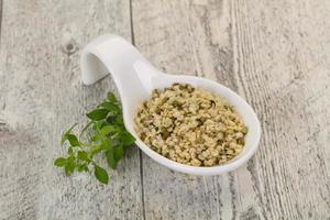 Peeled hemp seeds in the bowl photo