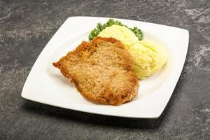 Crispy chicken schnitzel with mashed potato photo