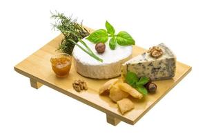 Assorted cheese - brie, dor blue and hard old yellow cheese photo