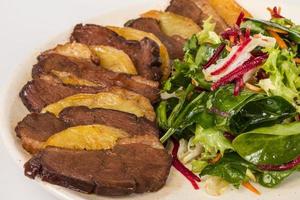 duck fillet, mashed potatoes seasoned with truffle oil, fig and aniseed sauce photo