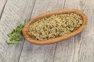 Peeled hemp seeds in the bowl photo