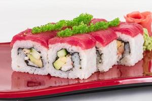 Maki Sushi - Roll made of Crab, avocado, cucumber inside. Fresh Tuna and tobico roe outside photo