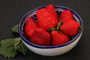 Ripe sweet strawberry with leaf photo