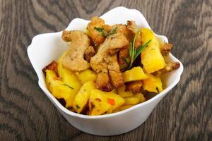 Fried potato with pork photo