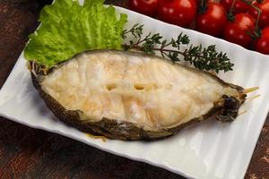 Baked wolffish steak photo