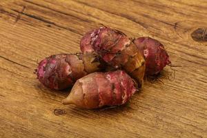 Raw topinambur root or Jerusalem artichoke photo