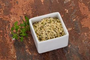 Peeled hemp seeds in the bowl photo