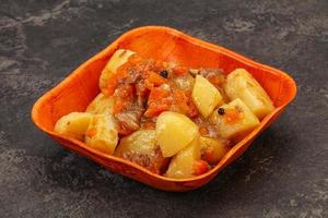 Roasted potato and beef with sauce photo