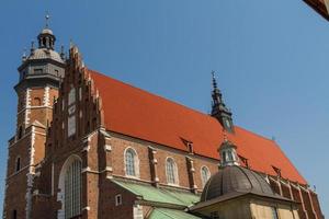 Cracow - Corpus Christi Church was founded by Kasimirus III The Great about 1340. The front elevation has a gothic gable whilst decoration of the interior is baroque photo