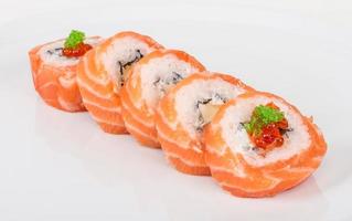 Japanese sushi traditional japanese food.Roll made of salmon, red cavair, roe and cream photo