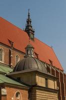 Cracow - Corpus Christi Church was founded by Kasimirus III The Great about 1340. The front elevation has a gothic gable whilst decoration of the interior is baroque photo