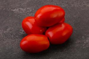 Red bright tasty tomato heap photo