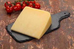Hard parmesan cheese piece photo