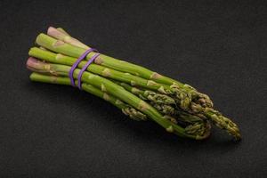 Vegan cuisine - Raw asparagus heap photo