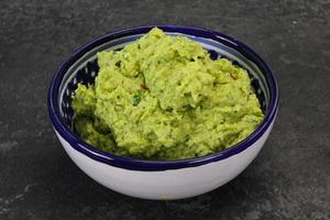 Avocado guacamole sauce with chili pepper photo