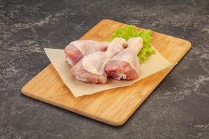 Raw chicken drumsticks for cooking photo