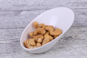 Cashew nuts heap in the bowl photo