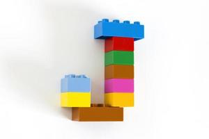 Colorful toy brick letter J photo