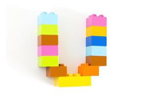 Colorful toy brick letter U photo